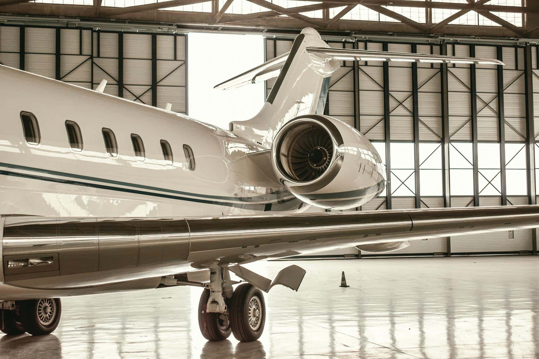 Private jet parked in a hangar at Feathers Aviation in Austin, Texas